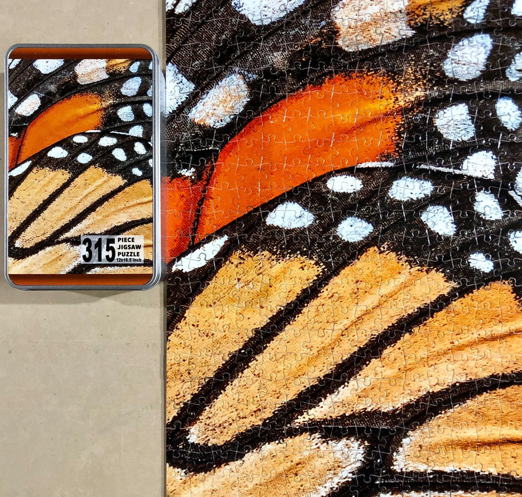 315 piece custom puzzle with metal tin packaging