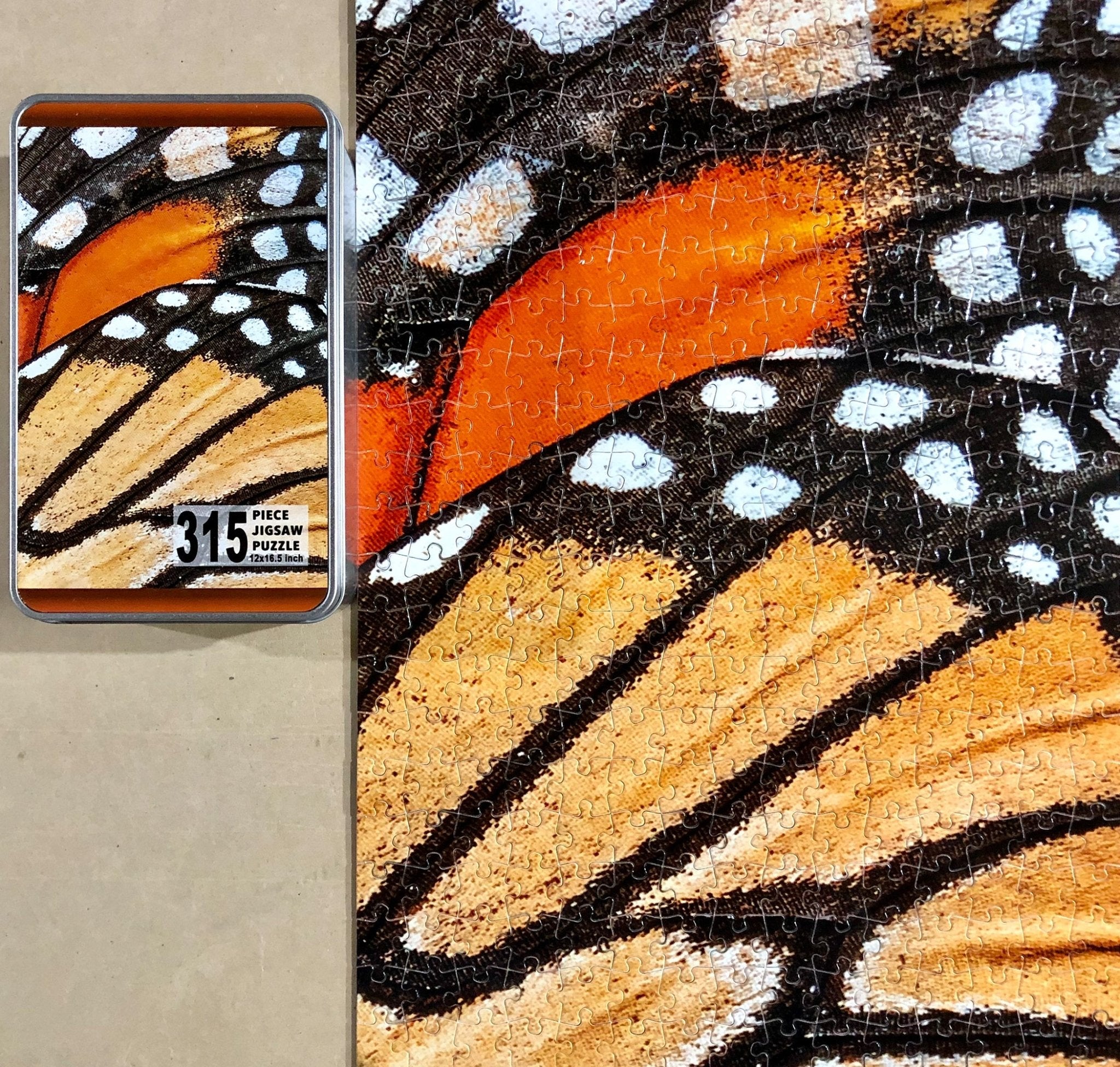 315 piece custom puzzle with metal tin packaging