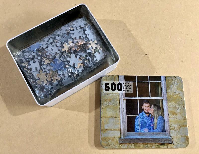 Custom 500 piece jigsaw puzzle broken apart and put into a matching metal tin container.