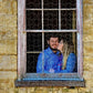 Custom 500 piece jigsaw puzzle with an image of a couple kissing in a window